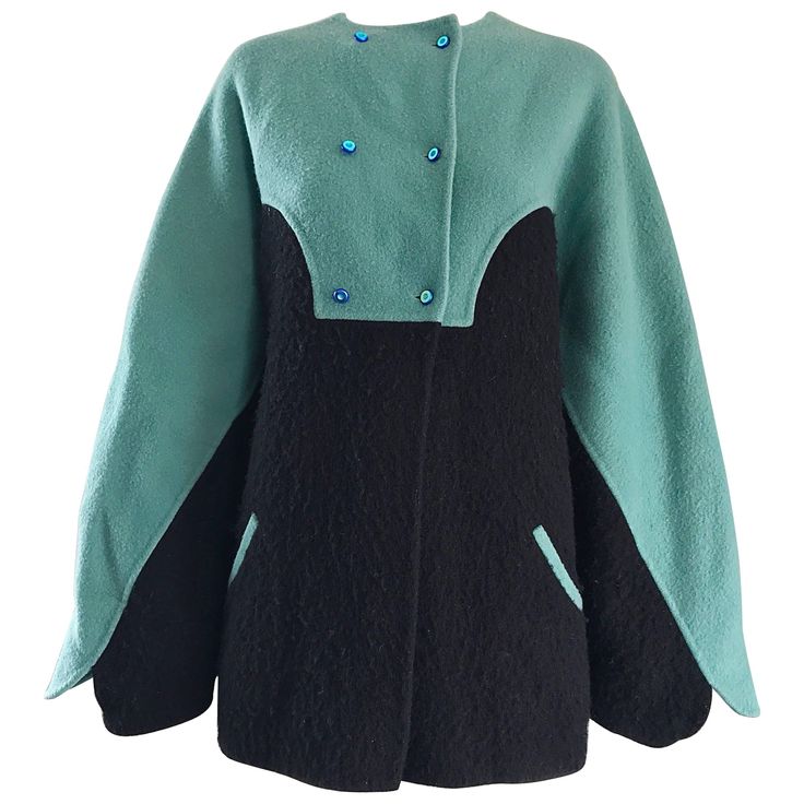 Amazing and important 1980s GEOFFREY BEENE teal aqua blue and black color block boiled wool swing jacket (almost looks like a cape ) ! Incredible amount of detail on this beauty, including hand-sewn workmanship. Small iridescent blue buttons at the top of the front. Angular sleeve cuffs can easily be rolled up for shorter ladies. Pockets at each side of the waist. The perfect everyday fall and winter coat! In great condition. Made in USA. Approximately Size Small - Large (swing style can fit man Checkered Wool Coat, Cropped Blazer Jacket, Concept Clothing, Reversible Coat, Geoffrey Beene, Suede Coat, Jacket Fashion, Collared Coat, Boiled Wool