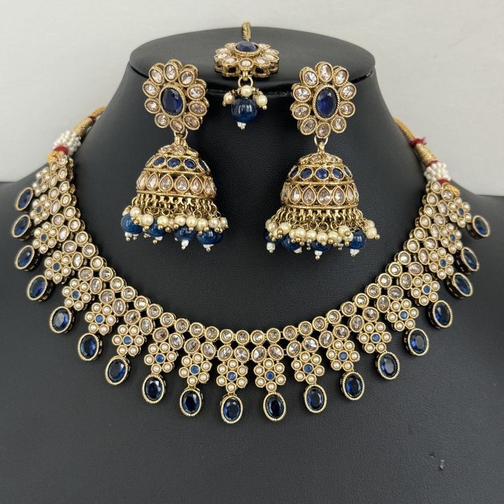 Blue Antique Polki Kundan necklace set/Reverse Ad Necklace/Statement necklace/Indian/Punjabi Necklace/Pakistani Jewelry/Bridal necklace/ Antique Reverse Ad Stone Necklace With Mehndi Plating Regular Size And Adjustable Stone Necklace Antique Necklace Set with dull gold finish  This is 100% Handmade jewelry. So Color, shades, texture displayed may slightly vary from the actual product due to digital image limitations. We request you to consider these minor variations. Please expect the possibility of some slight imperfections when buying hand made jewelry. If you have any questions, please message or email us. Arrives in gift box. Please let me know if you have any questions. Thank you so much visiting my shop. Festive Blue Necklace, Blue Meenakari Chandbali Necklace, Blue Kundan Necklaces For Ceremonial Occasions, Blue Meenakari Bridal Necklace In Temple Jewelry Style, Ceremonial Blue Kundan Necklaces, Blue Bridal Necklace In Temple Jewelry Style With Meenakari, Ceremonial Blue Kundan Necklace, Blue Meenakari Temple Jewelry Set, Blue Necklace With Intricate Design For Festivals