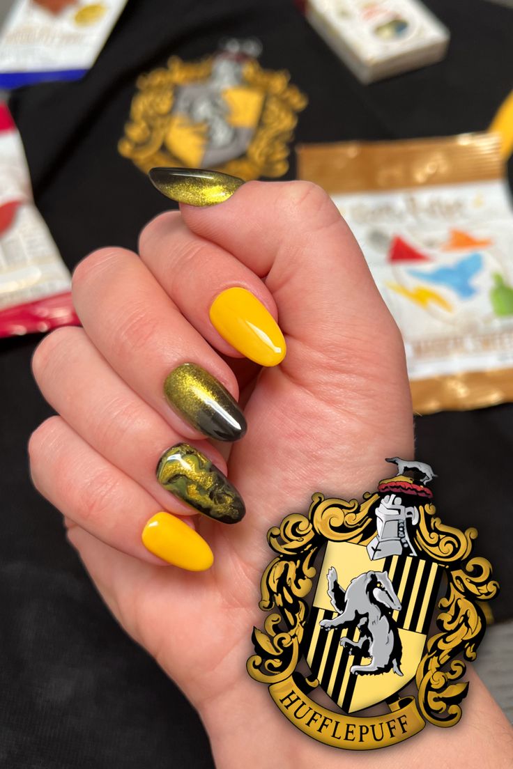 Needed a new set for the Hogwarts Legacy game release and came up with a cute variety of yellow, gold, and black. Used a small beauty blender to achieve the gold-black ombre, and learned a marble technique for the smokey yellow, gold, and black swirl. #harrypotter #hufflepuff #hogwarts #hogwartslegacy #pressonnails #nails #nailart Hufflepuff Nails, Hogwarts Legacy Game, Harry Potter Nails Designs, Harry Potter Nail Art, Winter Nail Art Designs, Harry Potter Nails, Black Ombre Nails, Fingernails Painted, Hogwarts Legacy