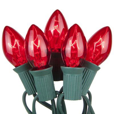 red christmas lights with green wire on white background