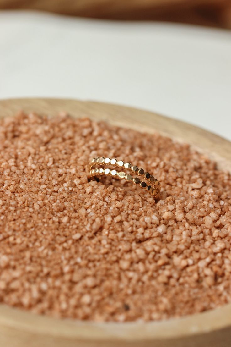 Wear this hammered ring individually for a simple adornment, or stack with other rings for a stronger statement. 2mm band width. Jess pairs it with our Cigar Band, Dani Chain Ring, and two Confetti Rings. Also shown with our Dylan Chain Ring and Swell Ring. Handmade in Eau Claire, WI. All of our jewelry is handmade to order just for you so each piece will be unique and may vary slightly from what is pictured. Hammered 14k Gold Stackable Rings, Simple Hammered 14k Gold Rings, Minimalist Hammered 14k Gold Stackable Rings, Minimalist Hammered Stackable Rings In Recycled Gold, 14k Gold Hammered Stackable Promise Rings, Dainty Hammered 14k Gold Rings, Dainty 14k Gold Hammered Rings, Minimalist Hammered Gold Stackable Rings, Hammered 14k Gold Midi Rings