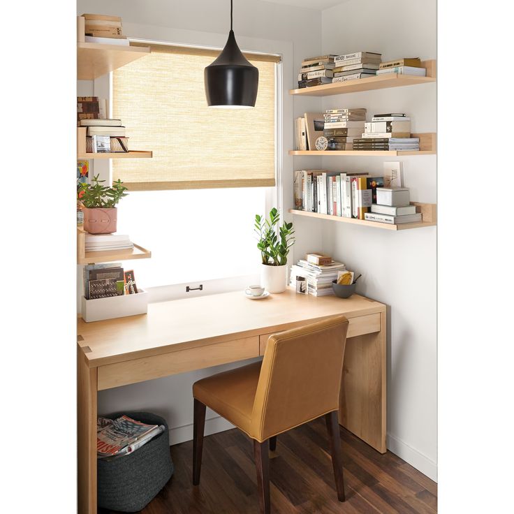 a home office with wooden shelves and shelvings on the wall, along with a desk