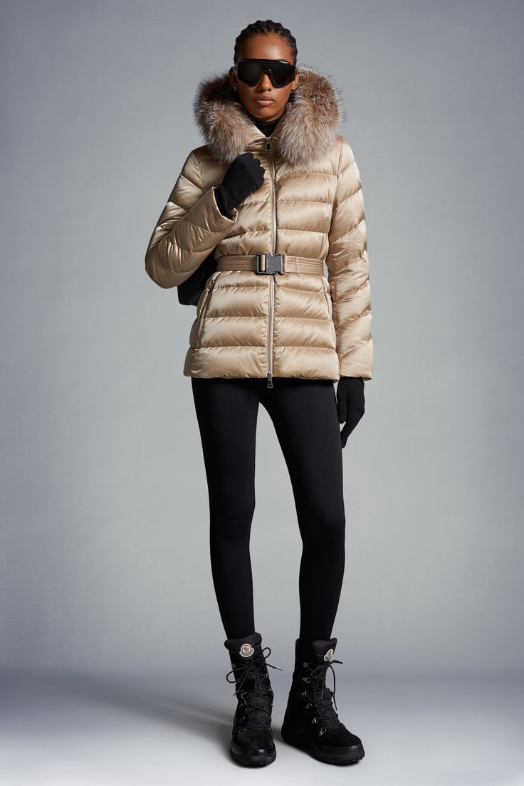 The Cupidone down jacket delivers a sophisticated winter look, showcasing a feminine silhouette accentuated by a belted waistline. Crafted from nylon satin, the hooded puffer jacket is finished with a luxurious fox fur trim. Personalized Jacket, Jacket Beige, Hooded Puffer Jacket, Feminine Silhouette, Down Jackets, Sand Beige, Cardigan Top, Ski Pants, Shell Jacket