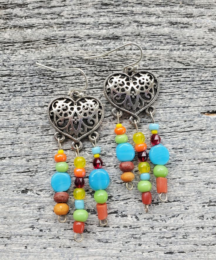 Southwestern Silver Heart Earrings Colorful Cowgirl Earrings Handmade Rainbow Filigree Earrings Arizona Rustic New Mexico Tribal Indian Nickel-free Bohemian Beaded Earrings For Crafting, Multicolor Nickel-free Beaded Earrings For Festival, Bohemian Sterling Silver Heart Earrings, Southwestern Dangle Beaded Earrings For Gifts, Southwestern Dangle Beaded Earrings As Gift, Bohemian Metal Heart Earrings As Gift, Bohemian Handmade Sterling Silver Heart Earrings, Multicolor Dangling Beads Jewelry Made Of Czech Glass, Colorful Nickel-free Beaded Drop Earrings