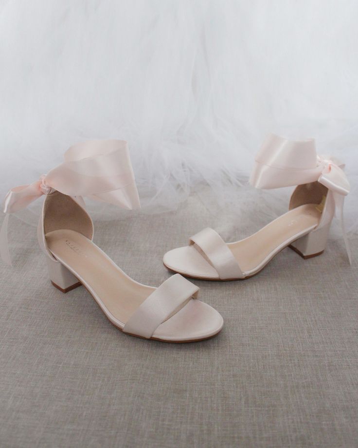 Classy satin block heel with satin ribbon ankle tie. Simple yet elegant are great combination and will definitely be a favorite.DETAILS:FIT: RUNS LARGE, ORDER ONE SIZE DOWNHEEL HEIGHT: 1.25 inches (kids) & 2 inches (women)RIBBON WIDTH: 1.5 inchesCOLORS AVAILABLE: Black, Burgundy, Champagne, Ivory, Navy, White, Light Blue, & Soft BlushUPPER: Synthetic upper and liningMATERIALS: Mandmade outsole STYLE NAME: NAOMI Soft Pink Wedding, Pink Wedding Shoes, Wedding Aesthetics, Heels Aesthetic, Platform Shoes Heels, Bridesmaid Shoes, Blue Soft, Ankle Strap Pumps, Bride Shoes