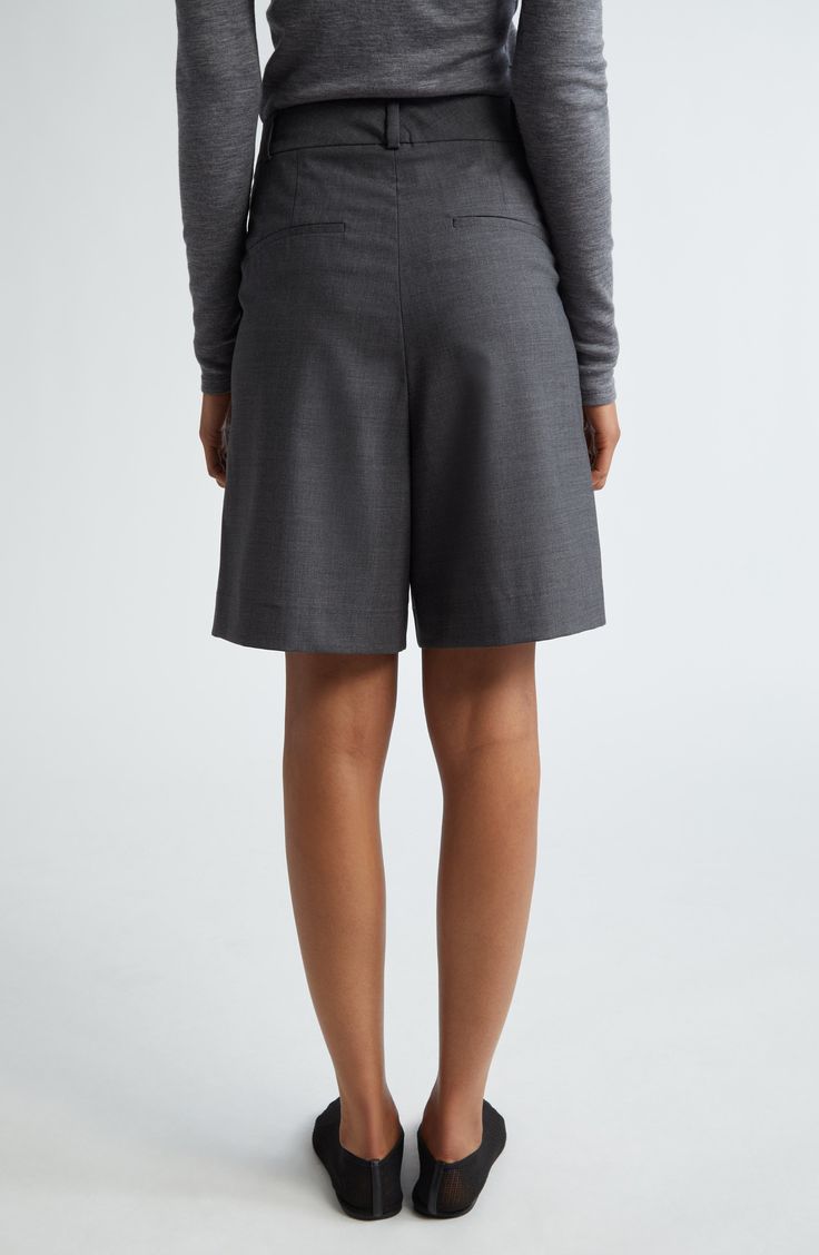 Sun-ready shorts take a sophisticated turn with this pleated virgin-wool pair featuring trim-fit pockets and a roomy wide-leg fit. Zip fly with hook-and-bar closure Front slant pockets; back welt pockets 98% virgin wool, 2% elastane Hand wash, line dry Made in Portugal Elegant Short Culottes For Spring, Elegant Short Length Culottes For Spring, Elegant Short-length Spring Culottes, Elegant Bermuda Shorts For Workwear, Elegant Formal Shorts With Belt Loops, Elegant Office Shorts With Pockets, Elegant Short Bottoms With Box Pleat, Elegant Tailored Shorts With Pockets, Elegant Formal Shorts With Short Inseam