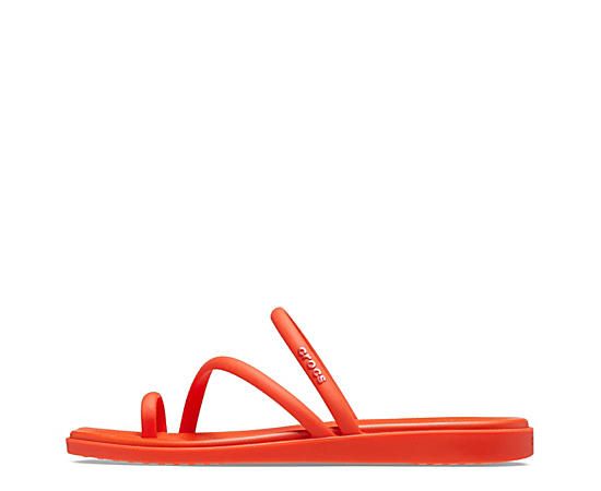 Crocs Miami Toe Loop Women's Sandal Maybe less is more in the Crocs Miami Toe Loop women's Sandal. With a flexible synthetic upper featuring a square toe for trendy style, this strappy Sandal is perfect for a beach getaway. The contoured, drop-in Croslite™ footbed cradles your foot while the low platform offers just enough lift to keep you grounded in summer cool. Synthetic upper  Slip-On w/ toe loop  Square toe  Drop-in footbed  1 1/4" platform Red Strappy Beach Sandals, Red Crocs, Toe Loop Sandals, Beach Getaway, Summer Cool, Rack Room Shoes, Rack Room, Beach Getaways, Trendy Style