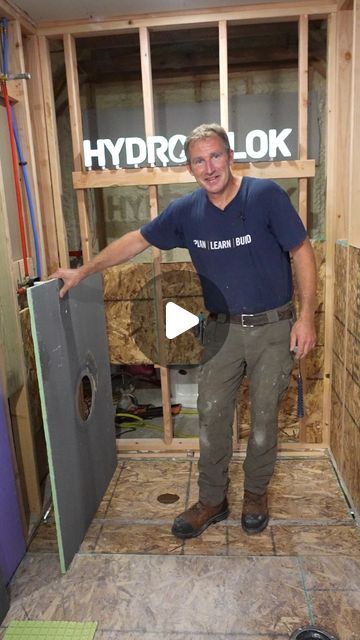 a man is standing in the middle of a room that has drywall and insulation on it