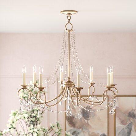 a chandelier hanging from the ceiling in a dining room