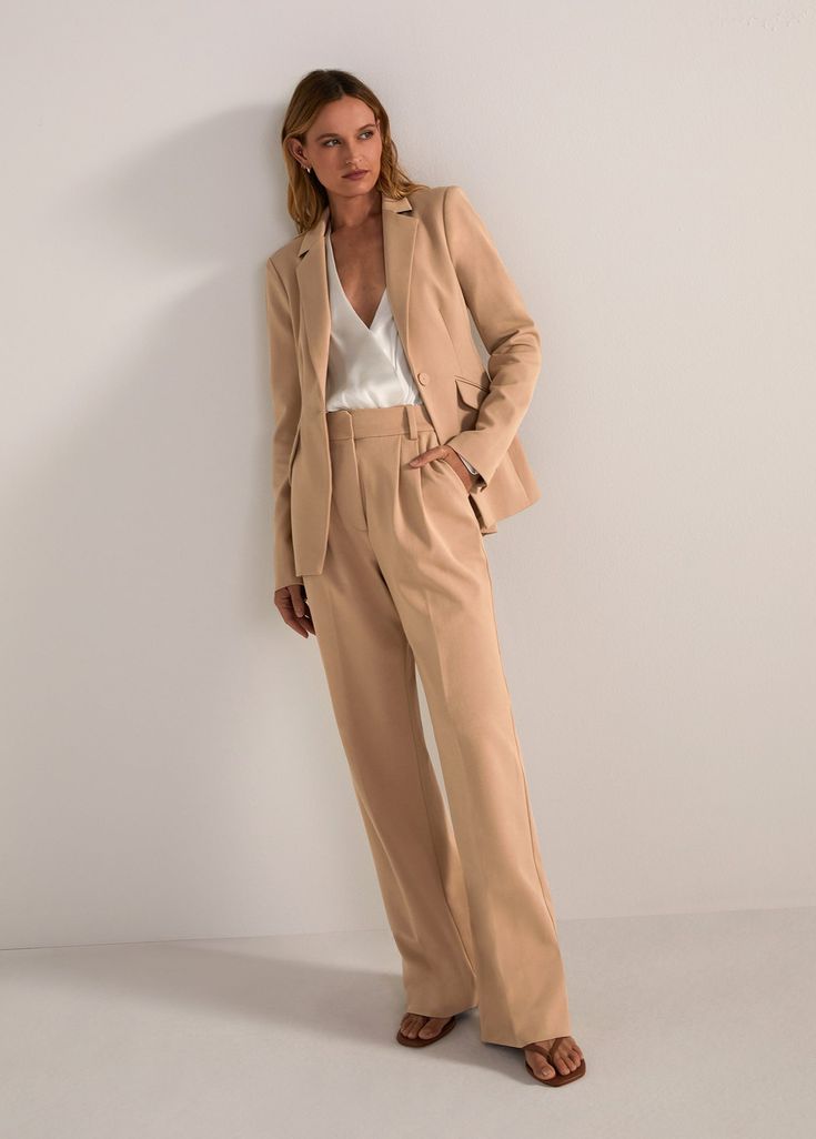 Everyone’s favorite. (Hence, the name.) These tailored, best-selling beauties have a fluid wide-leg silhouette with a high waist and front pleats. Crafted from a blend suiting fabric with front pockets and a relaxed fit, these beige trousers stand tall on their own but look especially sharp paired with the Favorite Blazer & coordinating vest.Inseam: 34"Rise: 12 3/4" 69% Polyester, 26% Rayon, 5% Spandex Inseam: 34"Models are wearing size 2 and 8Video: Misia is 5' 10" wearing a size 14 Timeless Wide Leg Pants For Workwear In Spring, Timeless Wide Leg Pantsuit For Office, Timeless Wide Leg Pantsuit, Timeless Wide Leg Office Pantsuit, Tailored Beige Wide Leg Pants, Beige Wide Leg Pants For Formal Fall Occasions, Classic Beige Pantsuit For Office, Classic Wide-leg Pantsuit For Work, Beige Pants With Pressed Crease For Office