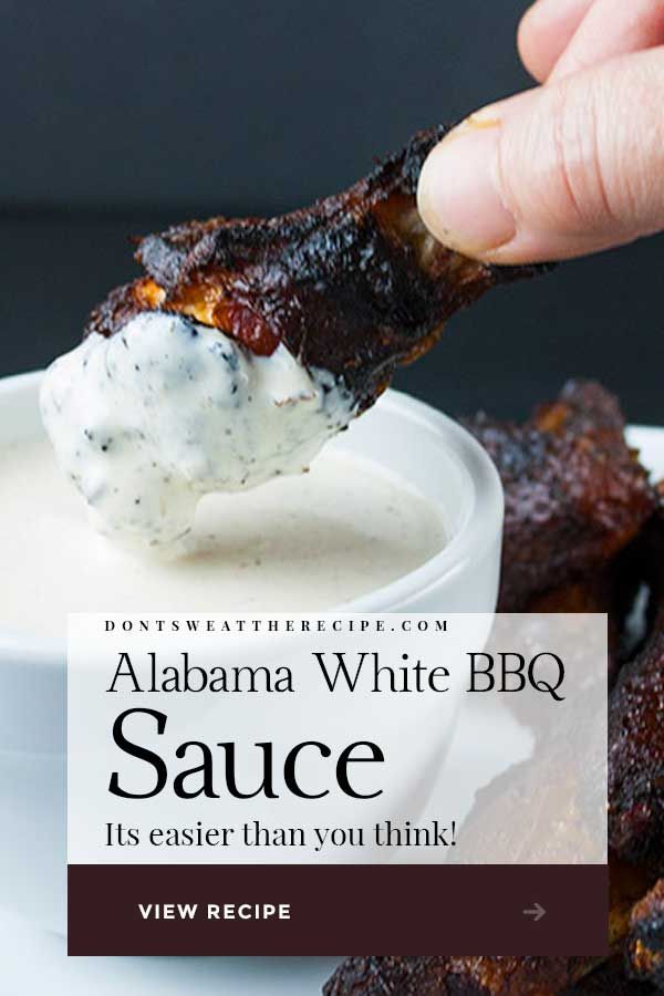 someone dipping sauce on some ribs in a white bowl with the words, obama white bbq sauce it's easier than you think