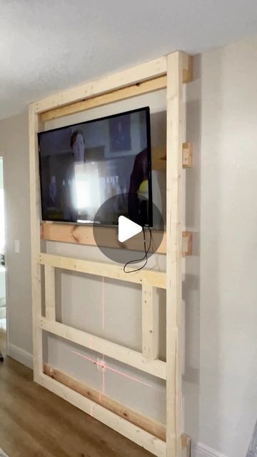 a flat screen tv mounted to the side of a wall