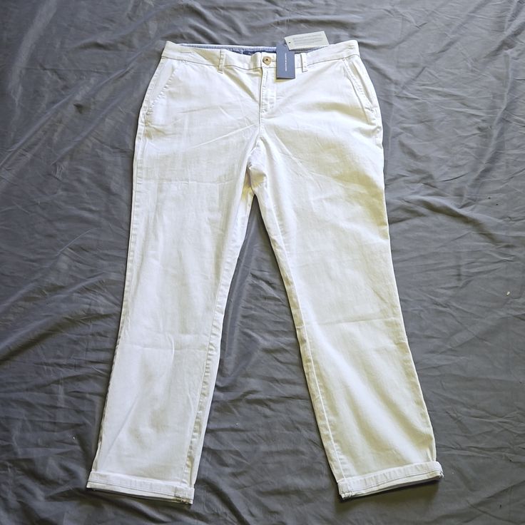 Tommy Hilfiger White Pants. White Tapered Leg Chinos For Spring, Spring White Chinos With Pockets, White Spring Chinos, Spring White Chinos, Tommy Hilfiger Tapered Leg Bottoms With Pockets, Tommy Hilfiger Tapered Leg Pants With Pockets, Tommy Hilfiger Stretch Cotton Bottoms, Tommy Hilfiger Spring Trousers, Casual Mid-rise Bottoms By Tommy Hilfiger