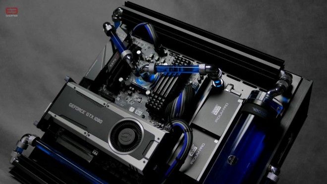 the inside of a computer case with blue and black parts