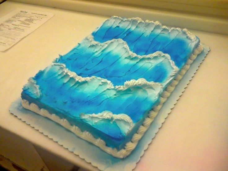 a blue cake sitting on top of a counter