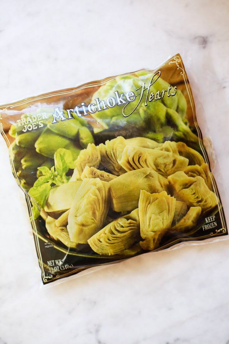 a bag of artichoke leaves sitting on top of a counter