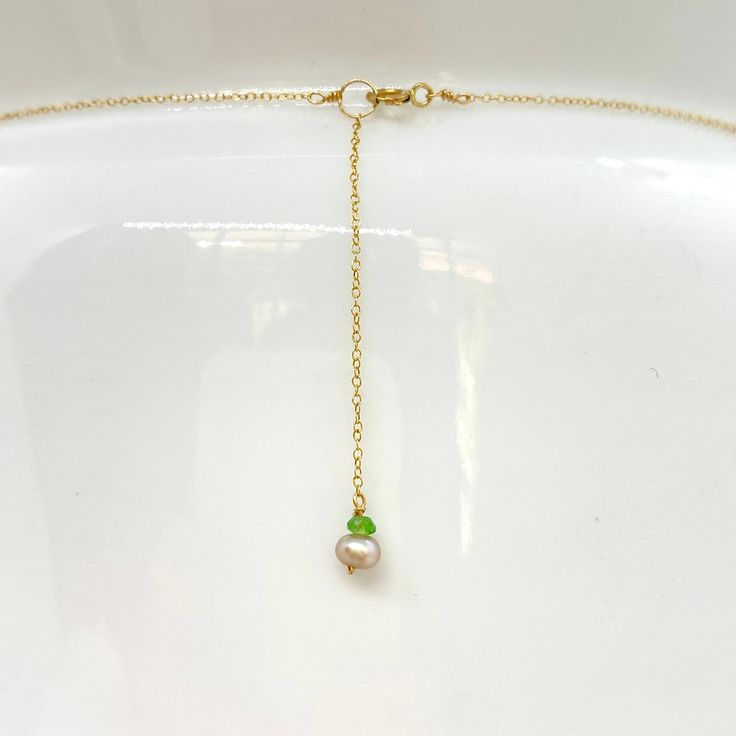 "Wire, Chain & Clasp: 14k Gold Stones: Carnelian Drop (approx. 18mm), Carnelian Bead (approx. 1mm x 2mm), 18k Gold Nugget (approx. 4mm) Necklace Length: approx. 17\" Backdrop: Freshwater Pearl & Tsavorite Backdrop Length: 1.75\" ------------------------------------------------------------ Let me know if you have any questions! *Size adjustable at client's request" Yellow Gold Gemstone Chain Necklace Gift, Gold Gemstone Lariat Necklace, Faceted Yellow Gold Jewelry For May Birthstone, Yellow Gold Faceted Jewelry For May Birthstone, May Birthstone Faceted Yellow Gold Jewelry, May Birthstone Yellow Gold Faceted Jewelry, Gold Charm Necklaces With Round Bead Gemstones, Adjustable Gold Pearl Necklace With Gemstone, Gold Briolette Single Strand Jewelry