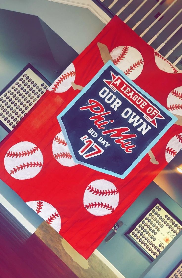 a baseball themed banner hanging from the ceiling