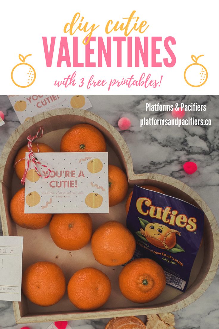 oranges in a heart shaped box with valentine's day cards