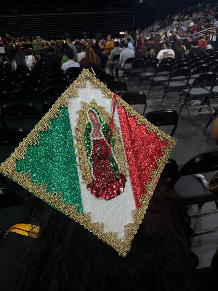 a graduation cap decorated with the flag of italy