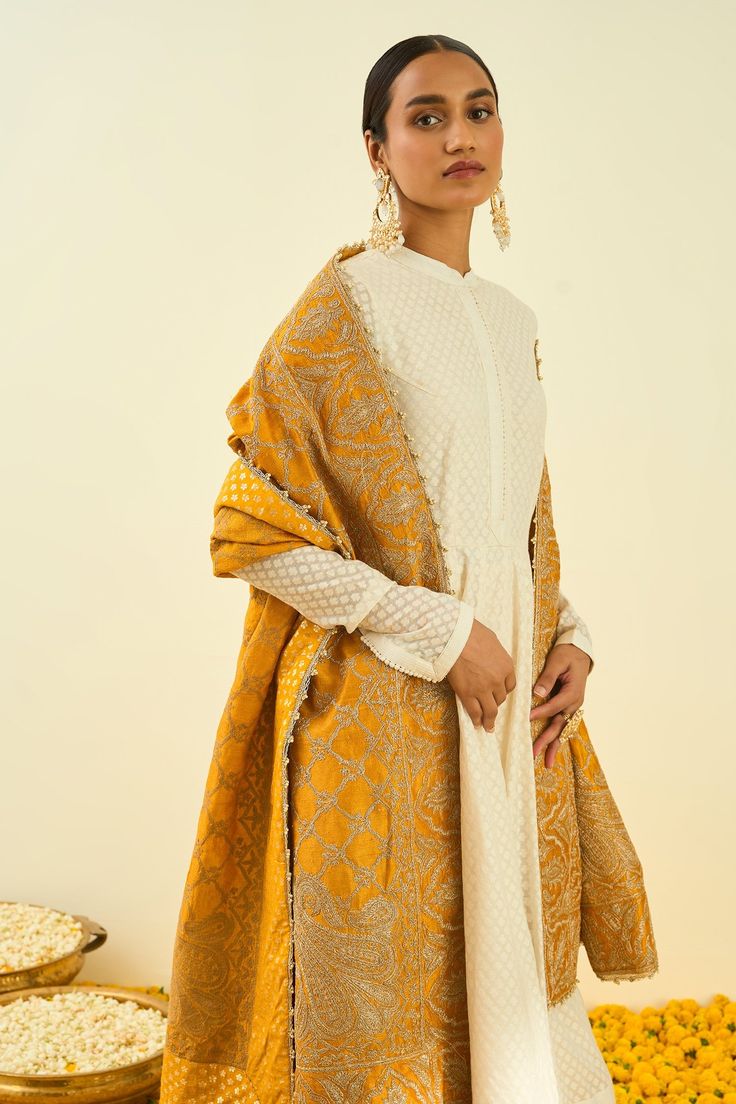 Glaze mustard dupatta with Kashmiri tilla embroidery in floral, paisley motifs and bead work hem.
Component: 1
Pattern: Embroidered
Type Of Work: Tilla
Fabric: Raw Silk
Color: Yellow
Other Details: 
Note: Kurta and pant worn by the model is not for sale
Occasion: Wedding,Mehendi - Aza Fashions Kashmiri Tilla Embroidery, Tilla Embroidery, Wedding Mehendi, Paisley Motifs, Embroidered Dupatta, Embroidered Silk, Raw Silk, Ethnic Fashion, Aza Fashion