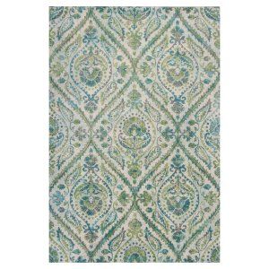 an area rug with blue, green and white designs