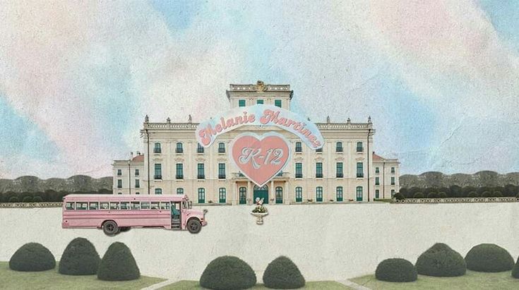 a pink bus parked in front of a large building with a heart on it's side