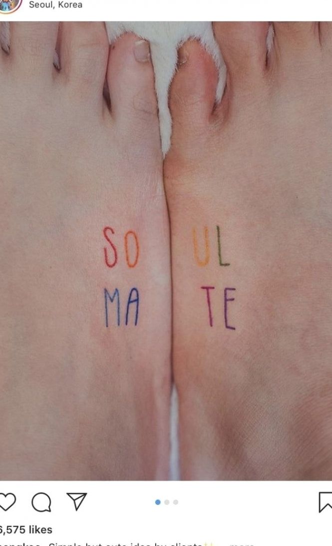 two feet with the words soul mate written on them