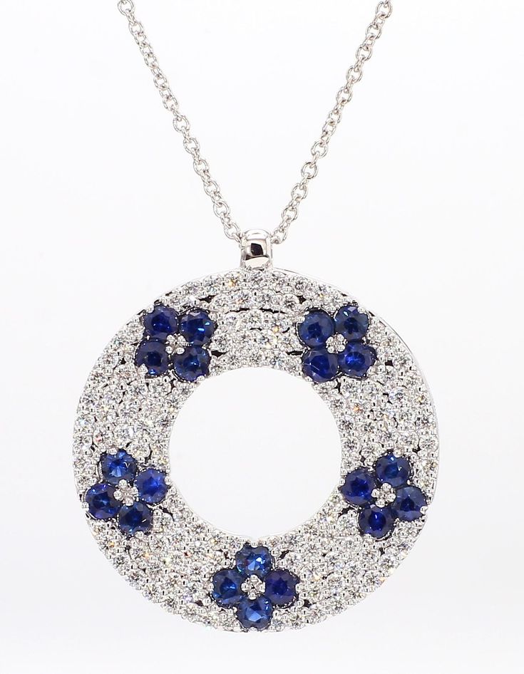 RareGemWorld's classic sapphire pendant. Mounted in a beautiful 18K White Gold setting with a natural round cut blue sapphires complimented by natural round cut white diamond melee. This pendant is guaranteed to impress and enhance your personal collection! Total Weight: 2.31cts Natural Round Blue Sapphires Natural Round White Diamonds  18K White Gold All diamonds are guaranteed natural International Shipments: Please note that customers are responsible for all import duties and taxes applicable to the country of shipment Returns: Returns accepted in original format within 14 days of receipt Do not forget to view our entire inventory! Thank you for reviewing our item Blue Sparkle, Round Sapphire, White Gold Necklace, White Gold Set, Blue Sparkles, Sapphire Pendant, White Gold Necklaces, White Diamonds, White Diamond