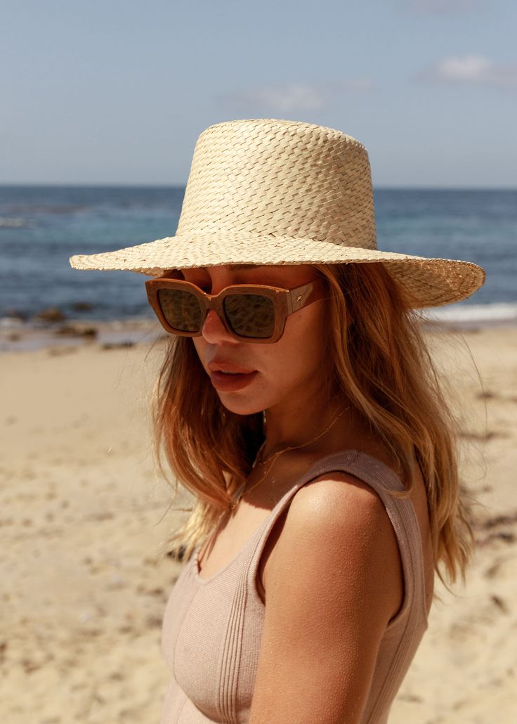 Our Catalina is a short-brim straw hat featuring a woven trim, a perfect sunny-weather staple. Ideal for those long days of sunlight featuring afternoons picnics and everything in-between. Lightweight Made from Straw *Sizes vary but measure about S/M: 21 IN M/L: 23 IN Spring Coastal Boater Hat Made Of Toquilla Straw, Chic Lightweight Straw Hat For Vacation, Lightweight Chic Straw Hat For Vacation, Chic Straw Sun Hat For Beach, Chic Straw Sun Hat For The Beach, Chic Boater Hat With Upf 50+ And Flat Brim, Chic Woven Sun Hat For Vacation, Summer Coastal Straw Hat, Woven Straw Sun Hat For Summer