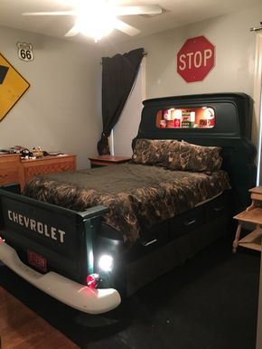 a bed room with a large bed and a red stop sign