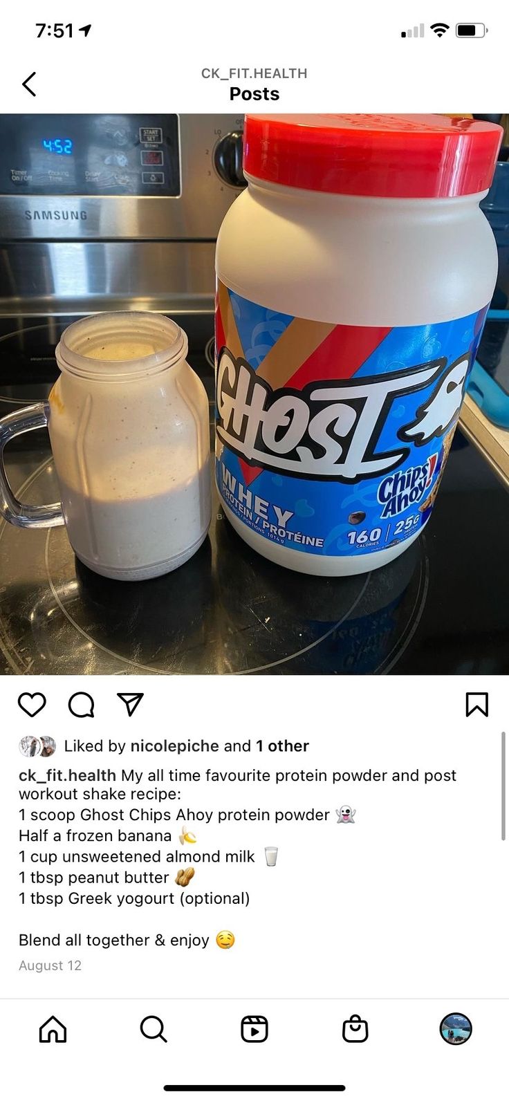 a bottle of ghost cream next to a container of powdered sugar on a counter