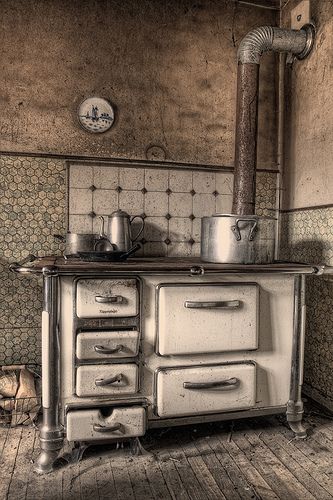 an old fashioned stove in the corner of a room