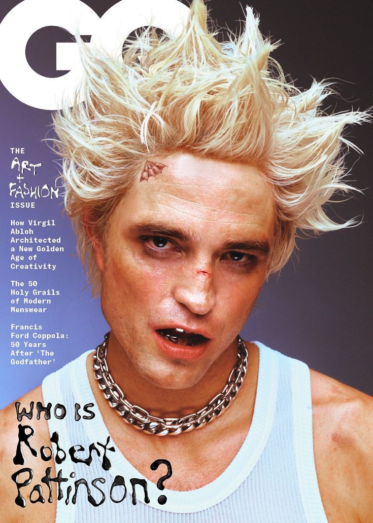 a man with blonde hair and piercings on the cover of gq magazine