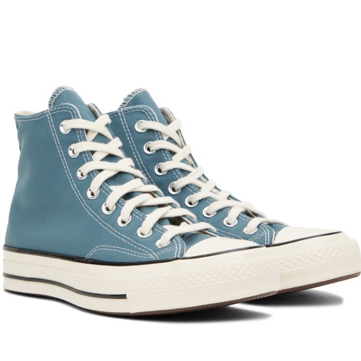 Item Info High-Top Canvas Sneakers In Blue. Rubber Cap Toe Lace-Up Closure Faux-Leather Logo Patch At Inner Side Rubber Midsole In Off-White Treaded Rubber Outsole In Brown Supplier Color: Deep Waters/Egret/Black Upper: Textile. Sole: Rubber. Blue Synthetic Sneakers With Gum Sole, Light Blue Leather High-top Sneakers With Rubber Sole, Blue Converse High-top Sneakers With Rubber Sole, Blue Low-top Sneakers With Rubber Toe Cap, Blue High-top Sneakers With Rubber Heel Cap, Light Blue Leather Sneakers With Gum Sole, Blue Sneakers With Rubber Heel Cap, Blue High-top Sneakers With Gum Sole, Casual Blue High-top Sneakers With Rubber Toe Cap