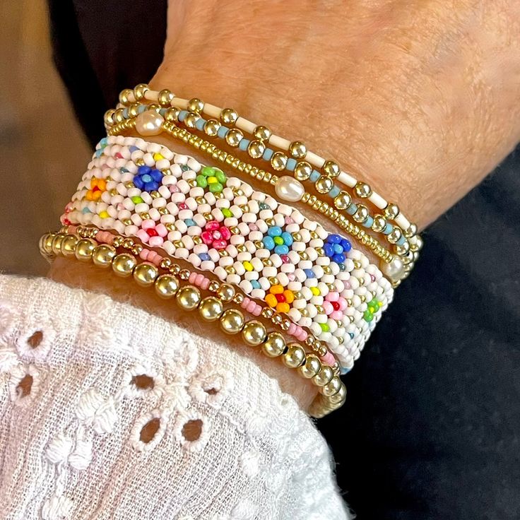 Colorful Beaded Confetti for Your Wrist! These colorful beaded bracelets are handcrafted in NYC and are the perfect addition to any wrist stack. Available in gold and silver, they provide a touch of color and fun. 14K yellow/rose gold-filled or sterling silver 3mm round beads; 1.6mm tube seed beads; stretch style. Prices are for 1 individual bracelet. Group pictures are provided for ideas on how to stack them with other Strands and Bands bracelets. Water safe, tarnish-resistant. Plain gold & sil Colorful Beads Bracelets For Friendship, Everyday Pink Beaded Jewelry, Bohemian Pink Jubilee Beaded Bracelets, Bohemian Pink Jubilee Beaded Bracelet, Beaded Stretch Bracelet For Friendship, Tiny Beads Bracelets For Jewelry Making, Colorful Beads For Friendship, Everyday Pink Beaded Bracelet, Pink Stretch Bracelet With Tiny Beads