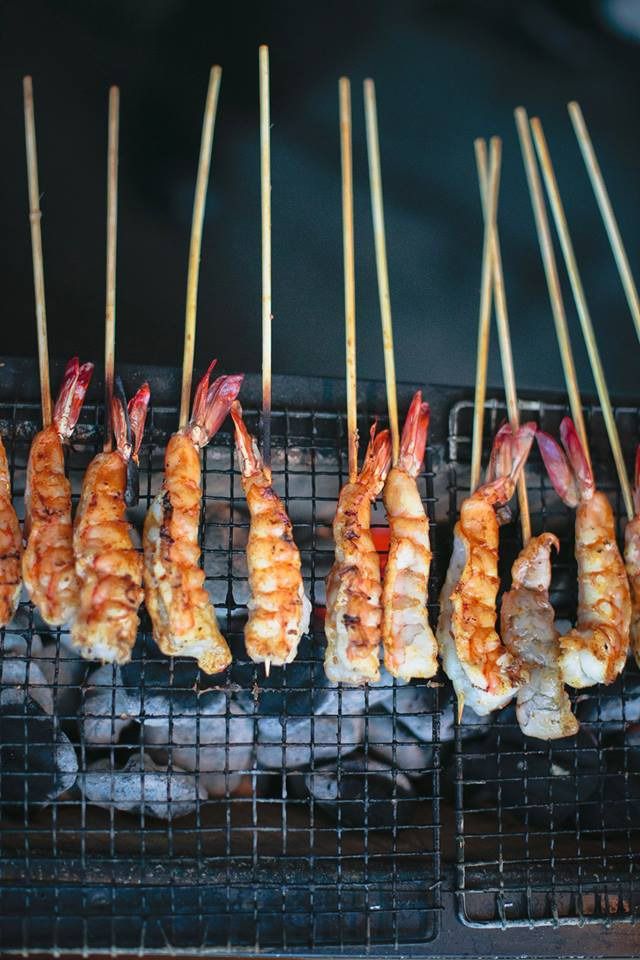 several skewers of food are being cooked on a grill with toothpicks