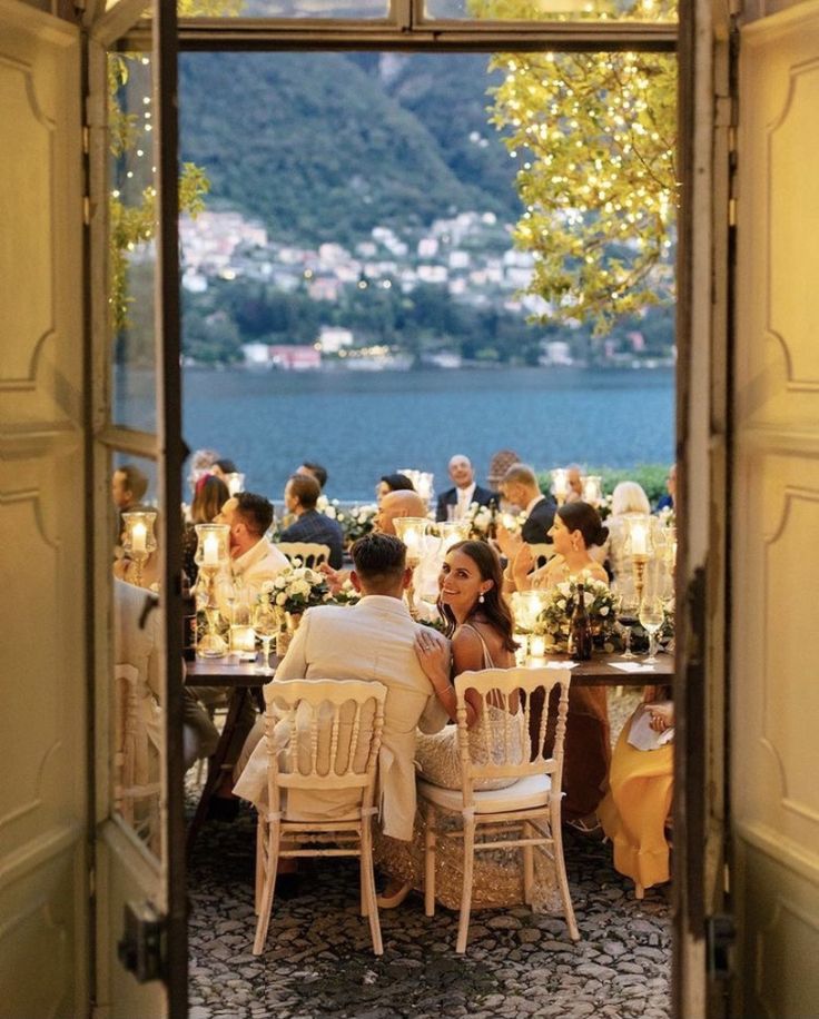 a group of people sitting around a dinner table