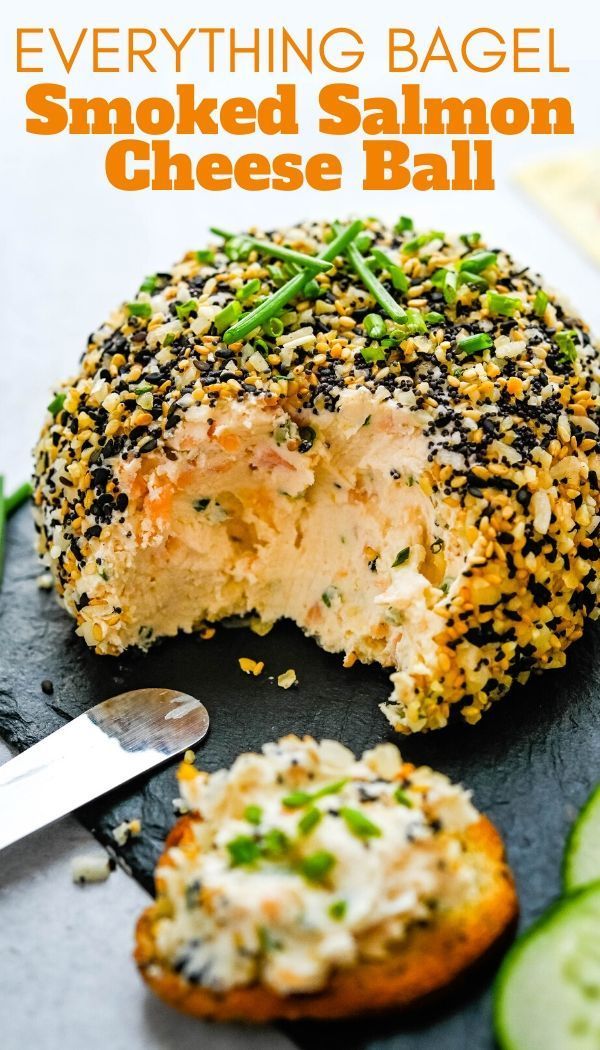 everything bagel smothered salmon cheese ball on a plate with cucumber slices