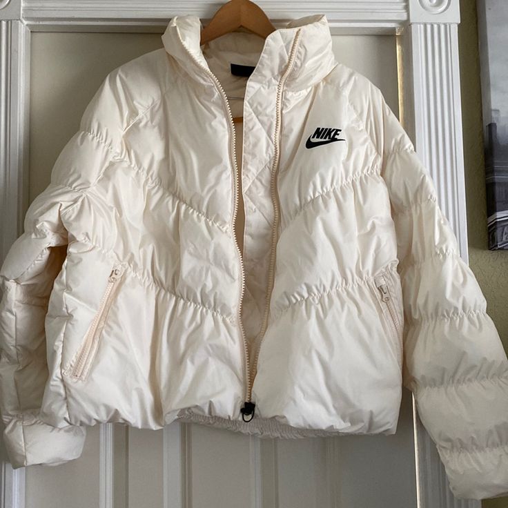 Nike Jacket Brand New No Tags Sizel Chest 23” Length 24” Nike White Outerwear For Cold Weather, Nike White Outerwear With Pockets, Nike Hooded Puffer Jacket For Spring, White Nike Outerwear With Pockets, Nike White Winter Outerwear, White Nike Outerwear For Winter, Nike Long Sleeve Puffer Jacket For Fall, Nike Winter White Outerwear For Fall, Fitted White Puffer Outerwear