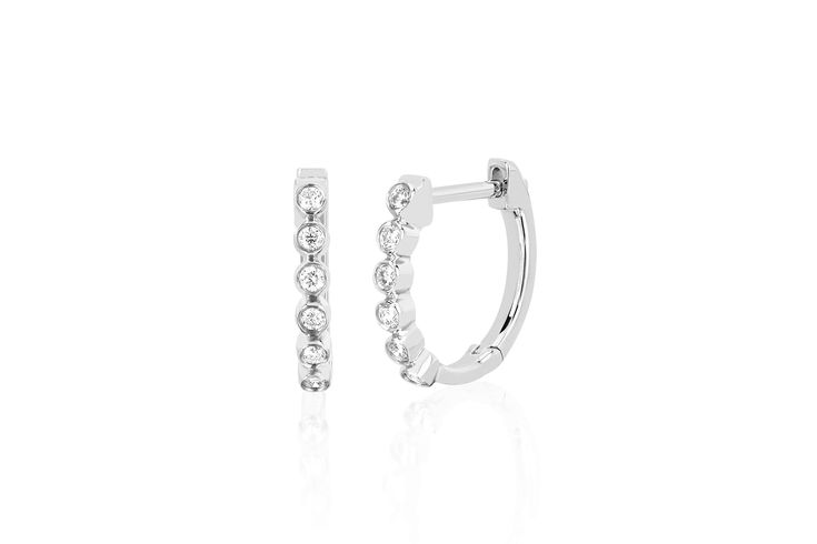 Our diamond bezel huggie earring features 0.11 carats of diamond set in 14k gold. Sold as a pair Diameter measures: 12mm Inner huggie diameter: 10mm Classic Huggie Earrings With Bezel Setting, Classic Bezel Setting Huggie Earrings, Diamond Huggie Earrings With Bezel Setting, Fine Jewelry Diamond Hoop Earrings With Bezel Setting, Diamond Hoop Earrings With Bezel Setting, Round Diamond Huggie Earrings With Bezel Setting, Classic Round Huggie Earrings With Single Diamond, Diamond Bezel Set Hoop Earrings, Elegant Round Huggie Earrings With Bezel Setting