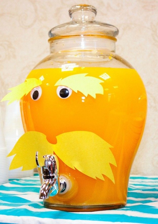 a glass jar filled with liquid sitting on top of a table