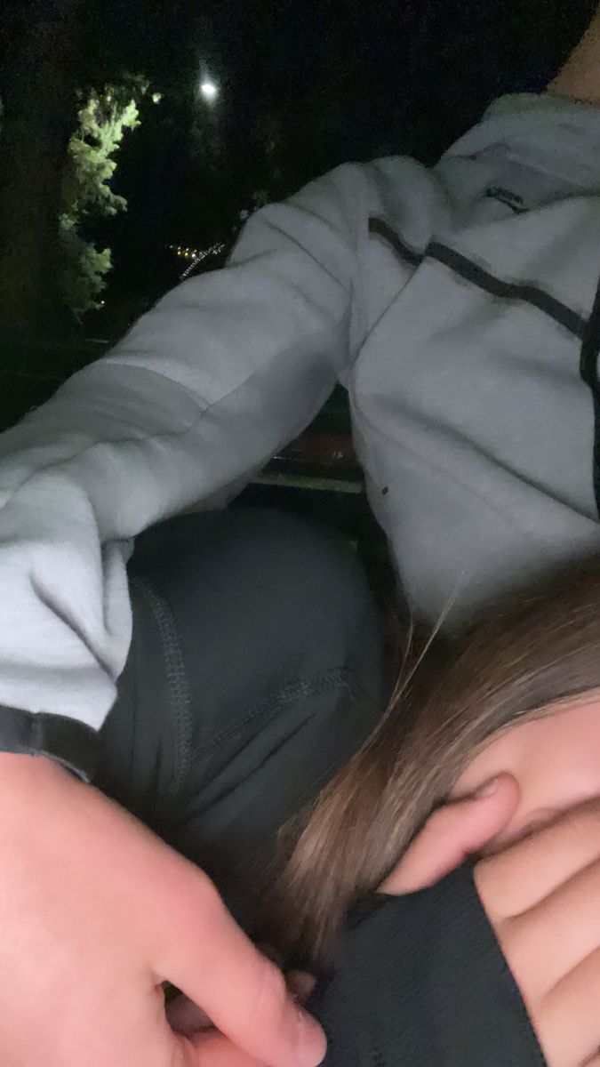 a person laying down with their head on another persons shoulder