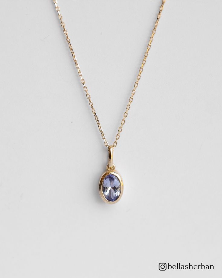 Enjoy the mesmerizing beauty of our 14K Solid Gold Oval Tanzanite Pendant Necklace, a stunning pendant that radiates elegance, refinement, and  grace.  This 14K solid gold necklace includes a breathtaking oval tanzanite--a gemstone recognized for its unique lavender color, which represents transformation and spiritual growth. The dainty design of the pendant adds a touch of modern elegance, making it a versatile and essential addition to your jewelry collection. Details * 14K Solid Gold  * 4x6mm Natural Oval-Cut Tanzanite * Removable Pendant  * Chain length: 40cm + 3cm (16" + 1.18") * Ready to ship in 14K yellow gold Processing time: The necklace is ready to ship in 14k yellow gold. If you wish to order it in 14K white gold, please note that the production process will take approximately 4 Elegant 14k Gold Birthstone Necklace With Oval Pendant, Elegant Oval Birthstone Necklace For Formal Occasions, Elegant Oval Pendant Birthstone Necklace, Elegant Yellow Gold Oval Pendant Birthstone Necklace, Elegant Oval Birthstone Necklace, Elegant Necklace With Si Clarity Oval Pendant, Elegant Oval Tanzanite Necklaces, Elegant Tanzanite Birthstone Necklaces, Elegant Tanzanite Necklaces For Anniversary