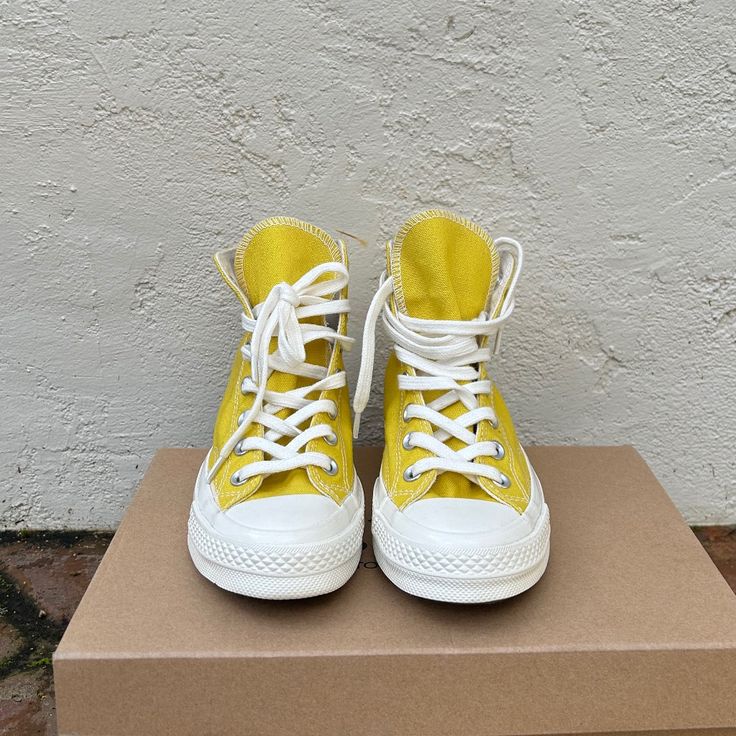 New Without Tags Converse High Top Sneakers In A Bright Yellow. Rare Model With White Lettering On Heel. Yellow Canvas High-top Sneakers With Vulcanized Sole, Yellow Canvas Lace-up High-top Sneakers, Yellow Lace-up Canvas High-top Sneakers, Yellow Converse Canvas Sneakers, Yellow High-top Canvas Sneakers, Spring Flat High-top Sneakers For Streetwear, Yellow High-top Sneakers With Vulcanized Sole For Spring, Yellow Canvas Sneakers With Round Toe, Casual Yellow High-top Canvas Shoes