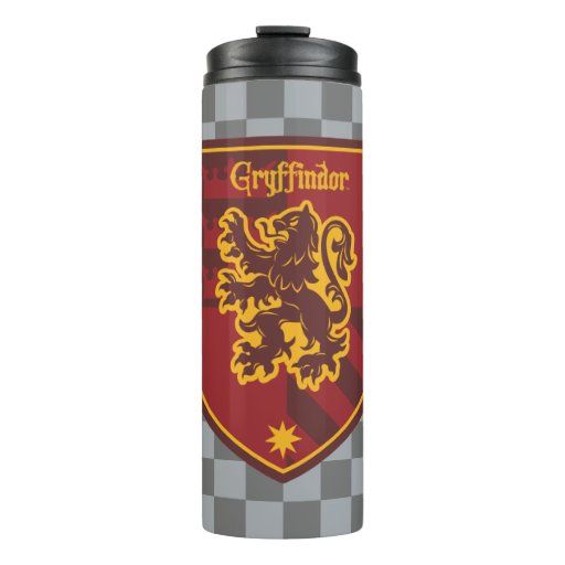 a stainless steel flask with a red and yellow crest