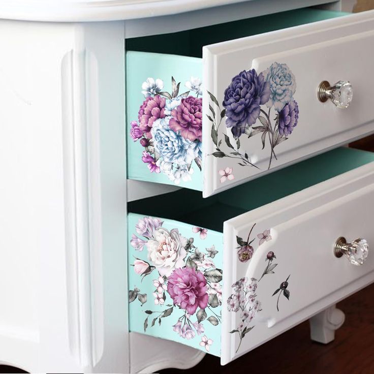 the drawers are painted with flowers on them