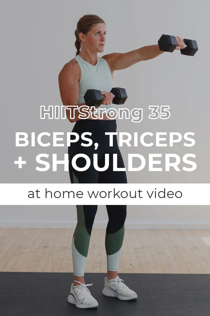 a woman holding two dumbbells in front of her face with the words hiit strong 55 biceps, triceps, shoulders and shoulders at home workout video