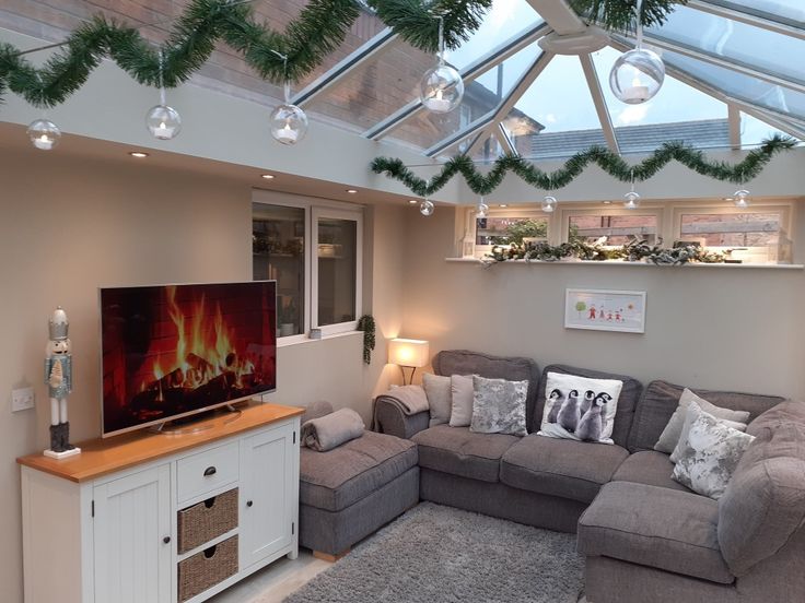 a living room filled with furniture and a flat screen tv