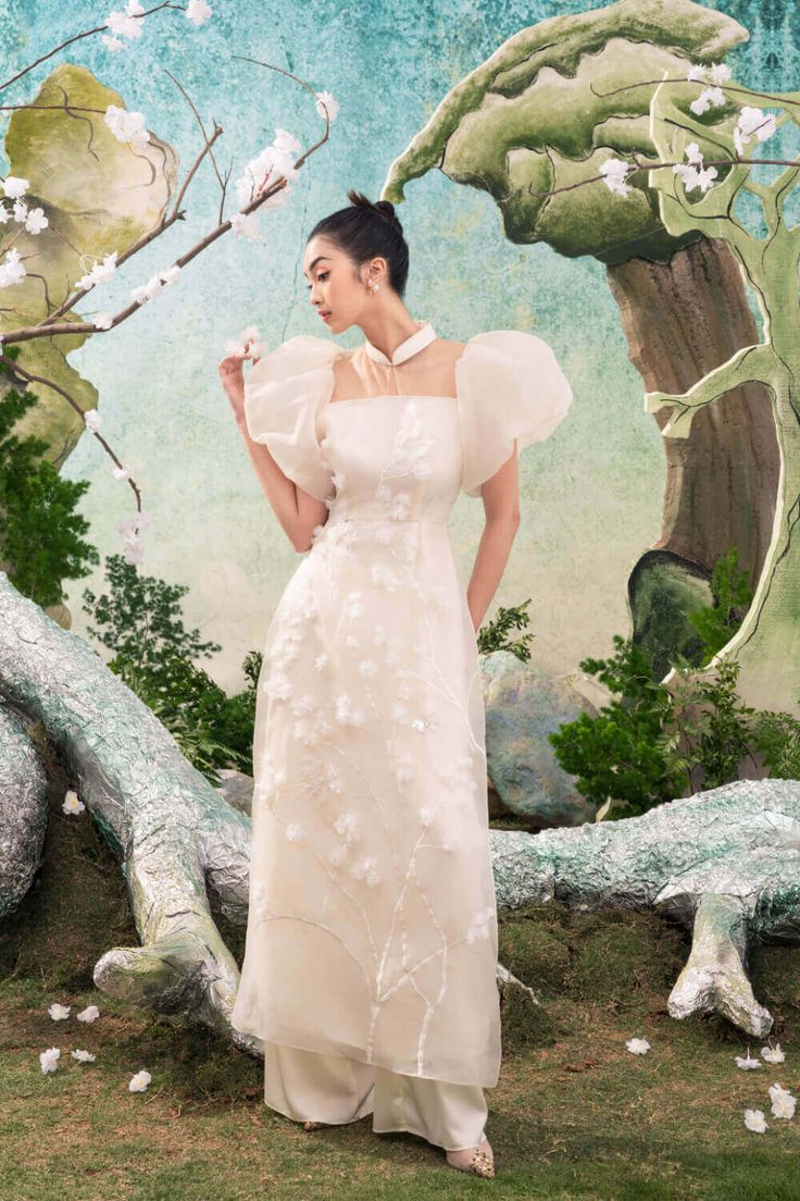 Wanda Mandarin Neck Ao Dai MEAN BLVD Modern Ao Dai, Grad Outfits, Vietnamese Wedding, Flower Pants, Mean Blvd, White Tone, Simple Pakistani Dresses, Peach Flowers, Puffy Sleeves